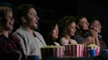 A group of people watching a movie showing emotion video