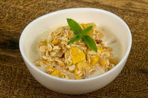 Muesli over wooden background photo