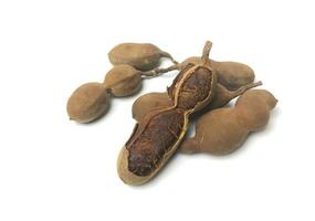 Tamarind, an Asian spice, on a white background photo