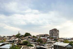 gray cloudy sky over old shabby houses in Yerevan photo