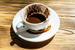 cup of Turkish coffee with grounds and patterns photo