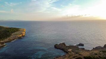 aerial drone view of the mediterranean coast at sunrise in portocolom, Majorca, balearic islands photo