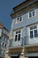 Facades of houses with tiles in the city of Porto in the summer of 2022. photo