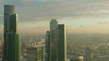 Moscow City Business Center Skyscrapers and Urban Skyline at Winter Morning. Russia. Drone Flies Upwards, Camera Tilts Down. Medium Shot video