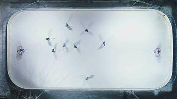 Playing Ice Hockey on Ice Rink. Aerial Vertical Top-Down View. Static Drone Shot video