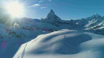 Blue Matterhorn Mountain in Sunny Winter Day. Swiss Alps. Switzerland. Aerial View. Drone Flies Forward at Low Level video