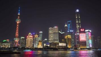 Panoramic Night Time Lapse of Illuminated Shanghai Skyline. Lujiazui Financial District and Huangpu River. View from The Bund Embankment. China video