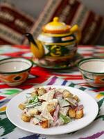 Malibu salad with crab sticks and croutons, feta cheese and vegetables. Asian style photo