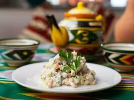 Olivier salad according to the Russian recipe. Asian style photo