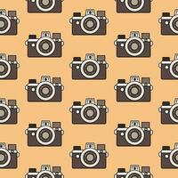 Cute seamless pattern vintage camera in retro colors, isolated on a beige background. Background, backdrop, wrapping paper. vector