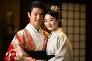 married japanese couple smiling posing together in traditional clothing kimono and hakama bokeh style background photo