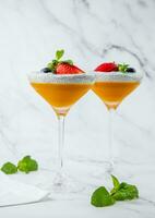 exotic fruit cocktails with berries and chia seed topping and mint side view photo