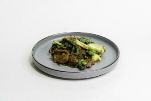 roasted on wok oyster beef with vegetables in sause photo