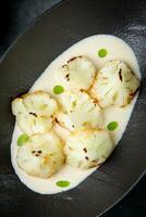 cooked cauliflower in mushroom sauce and lime photo