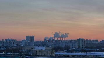 Day to Night Timelapse of Buildings in Sleeping District and Passing Trains at Sunny Winter Sunset. video