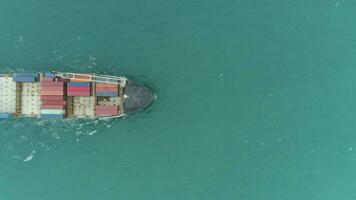 Cargo Ship in the Sea. Aerial Vertical Top-Down View. Drone is Flying Sideways video