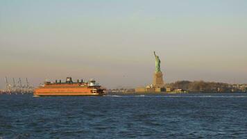 NEW YORK CITY, USA - NOVEMBER 21, 2018 Statue of Liberty and Staten Island Ferry in the Morning. Liberty Island, New York City. Boat View video