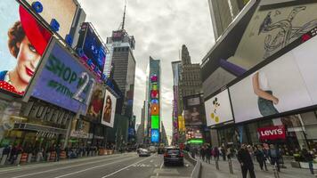 NEW YORK CITY, USA - NOVEMBER 21, 2018 Cars Traffic and People Crowd at Times Square at Cloudy Day. Time Lapse video