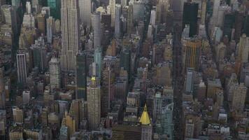 New York City in Summer Day. Midtown Cityscape of Manhattan. United States. Aerial View. Medium Reveal Shot. Camera Tilts Up video