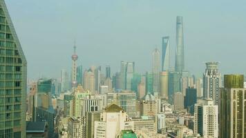 SHANGHAI, CHINA - MARCH 22, 2018 Shimao International Plaza and Lujiazui Skyline at Clear Day. Aerial View. Drone Flies Sideways and Upwards. video