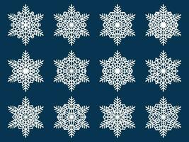 Set of laser cutting openwork snowflakes. Vector silhouette of christmas decoration. Template for paper isolated on blue background. Stencil for scrapbooking, carved wood.