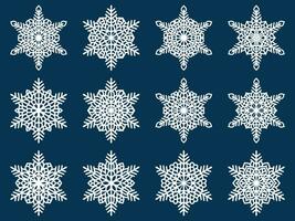 Set of laser cutting openwork snowflakes. Vector silhouette of christmas decoration. Template for paper isolated on blue background. Stencil for scrapbooking, carved wood.