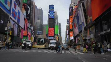 NEW YORK CITY, USA - NOVEMBER 21, 2018 Cars Traffic, Cyclists and People at Times Square at Day. Steadicam Shot, Moving Sideways on Crossroad. Slow Motion video