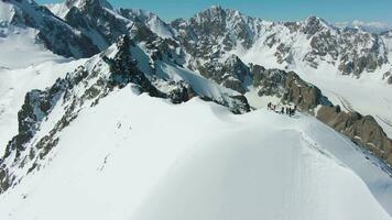 Blue Snow-Capped Mountains in Sunny Day. Tian Shan, Kyrgyzstan. Aerial View. Drone Flies Forward, Tilt Up. Wide Shot video