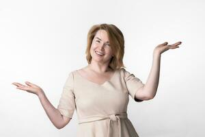 Woman gesticulating raised hands, palms up, depicting scales and looking at camera. Choice concept photo