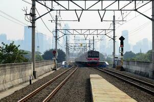 Commuter Line or electric train in Jakarta, Indonesia photo
