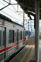 Commuter Line or electric train in Jakarta, Indonesia photo