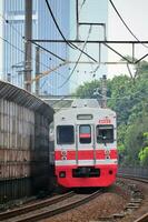 The train is running on the rails towards the destination photo