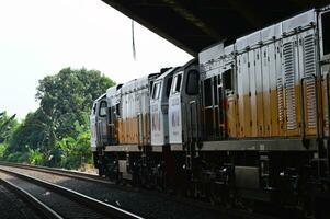 The train is running on the rails towards the destination photo