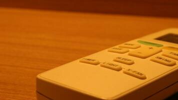 Close up of the air conditioner remote on the table photo