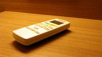 Close up of the air conditioner remote on the table photo