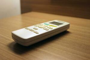 Close up of the air conditioner remote on the table photo