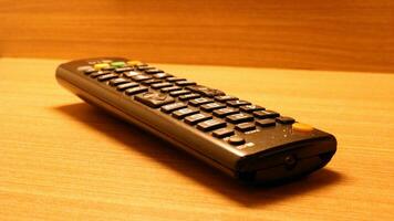 Close up of the television remote on the table photo