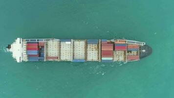 Container Ship in the Sea. Aerial Vertical Top-Down View. Drone is Flying Sideways video