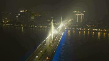 Bridge in Guangzhou City, Car Traffic at Night. Guangdong, China. Aerial Hyper Lapse, Time Lapse. Drone is Orbiting video