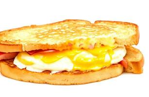 French toast ham bacon cheese sandwich with egg isolated on white background photo