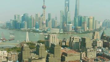 Shanghai City. Huangpu and Lujiazui District Cityscape at Clear Day. China. Aerial View. Drone Flies Downwards, Tilt Up video