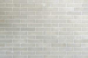 Vintage white brick tile wall pattern and background photo