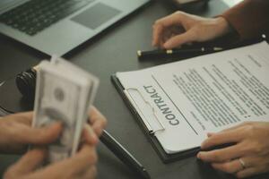 Business and lawyers discussing contract papers with brass scale on desk in office. Law, legal services, advice, justice and law concept picture with film grain effect photo