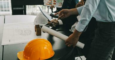 Construction and structure concept of Engineer or architect meeting for project working with partner and engineering tools on model building and blueprint in working site, contract for both companies. photo
