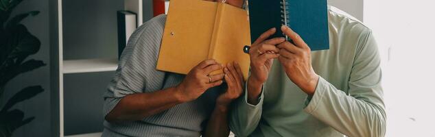 Embraced mature couple surfing the Internet on laptop at home photo