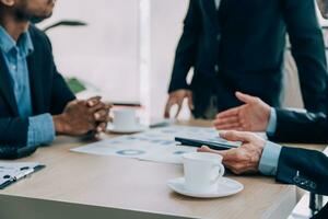 Entrepreneurs and business people conference in modern meeting room, happy multiracial coworkers have fun cooperating working together at office meeting, asian teamwork concept photo