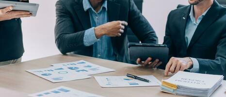 Entrepreneurs and business people conference in modern meeting room, happy multiracial coworkers have fun cooperating working together at office meeting, asian teamwork concept photo