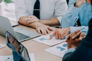 Entrepreneurs and business people conference in modern meeting room, happy multiracial coworkers have fun cooperating working together at office meeting, asian teamwork concept photo