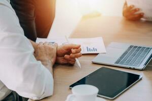 Entrepreneurs and business people conference in modern meeting room, happy multiracial coworkers have fun cooperating working together at office meeting, asian teamwork concept photo