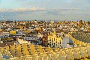 Metropol Parasol wooden structure with Seville city skyline in the old quarter of Seville in Spain photo